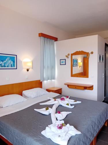 A bed or beds in a room at Heliotopos Apartments