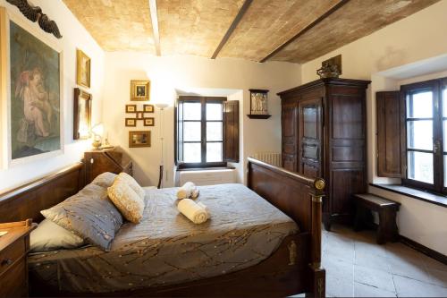 Letto o letti in una camera di GiuMa Tuscany Historic Lux Farmhouse near Saturnia Spa