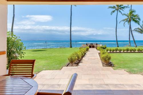 a patio with a view of the ocean at Maalaea Kai 315 in Wailuku