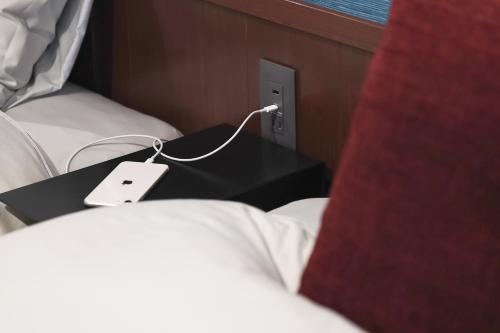 Postel nebo postele na pokoji v ubytování Higashiyama bau