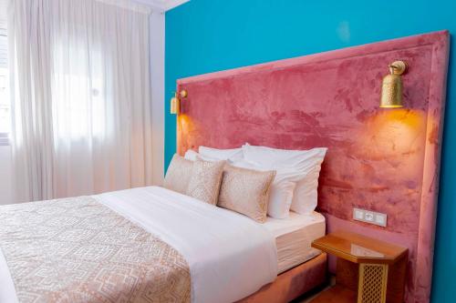 Una cama o camas en una habitación de Moroccan Floors - Suites Appart-Hôtel