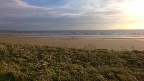 a view of a beach with the ocean at D&D Holiday Chalet in Bridlington