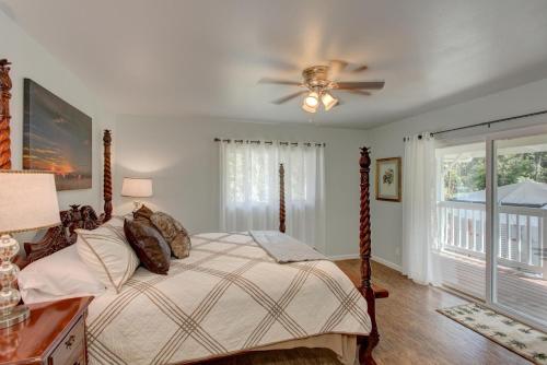 a bedroom with a bed and a ceiling fan at Fern Forest Hale in Volcano