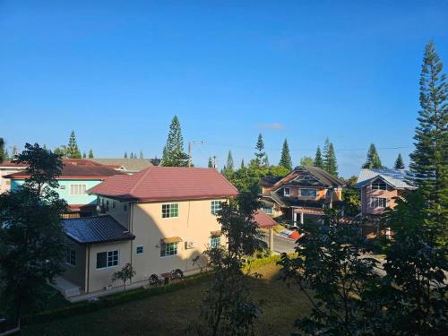 a group of houses in a town with trees at Pine suite Condo Tagaytay in Tagaytay