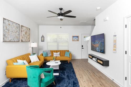 a living room with a couch and a table at Perfect Getaway Prime Location Game Room And HotTub in Charlotte