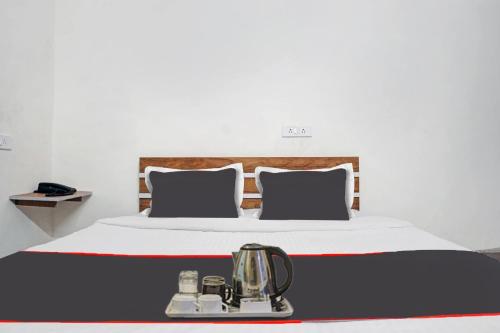 Ένα ή περισσότερα κρεβάτια σε δωμάτιο στο SPOT ON Hotel Deluxe