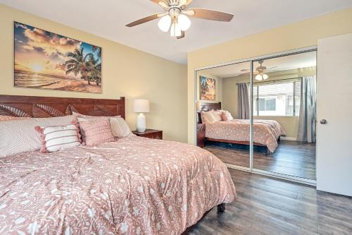 a bedroom with a bed and a ceiling fan at Ko Olina Fairways #4E in Kapolei