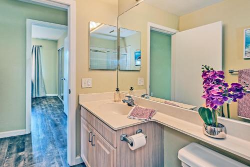 a bathroom with a sink and a mirror at Ko Olina Fairways #4E in Kapolei