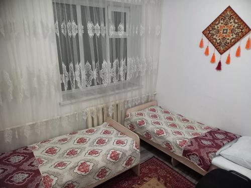 Postel nebo postele na pokoji v ubytování Hostel ASMAN