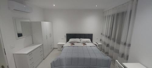 Postel nebo postele na pokoji v ubytování AJ GuestHouse