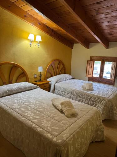 Postel nebo postele na pokoji v ubytování Retiro Gastro-Rural - Casa 2