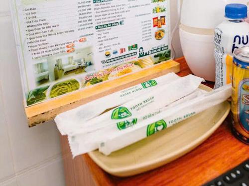 a counter with a refrigerator with some food on it at Mộc Hương Residences & Herb in Hue