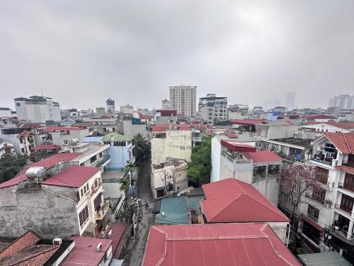 an overhead view of a city with buildings and roofs at The Little Hanoi - Cool Apartment - Lakeside in Hanoi