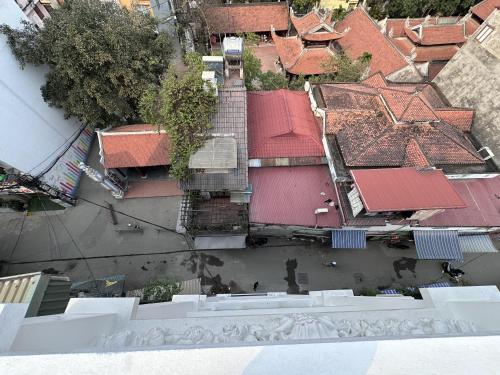 an overhead view of a group of buildings with roofs at The Little Hanoi - Cool Apartment - Lakeside in Hanoi