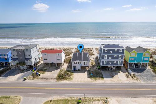 an aerial view of a beach with houses and the ocean at Somewhere on a Beach in Oak Island