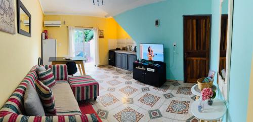 a living room with a couch and a kitchen at Misiones Depa33 in Posadas