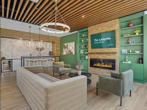 a living room with a couch and a fireplace at Stylish Luxe 1BR - Easy Access to NYC in Stamford