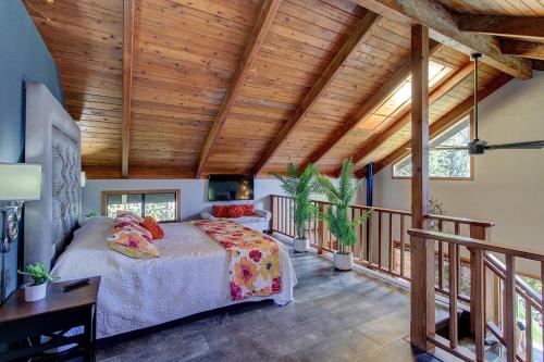 a bedroom with a bed in a room with wooden ceilings at Halehikiola in Volcano