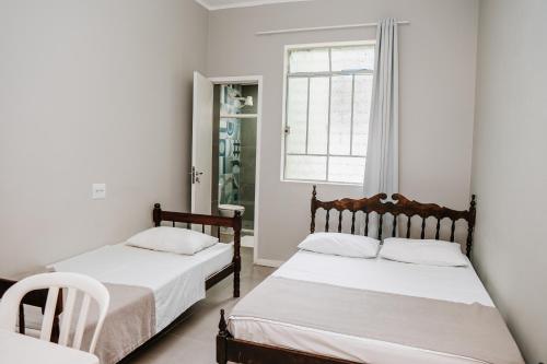 Postel nebo postele na pokoji v ubytování Hotel Pinheirinho