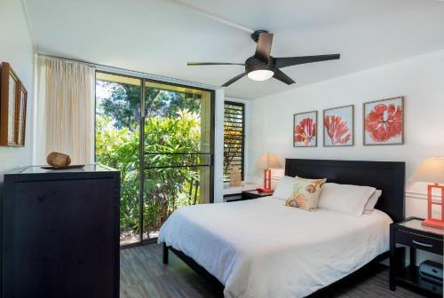 a bedroom with a bed and a ceiling fan at Turtle Bay Kuilima Collection 6 West in Kahuku