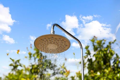 a shower with water coming out of it at Casa Bohemian Curacao in Dorp Soto