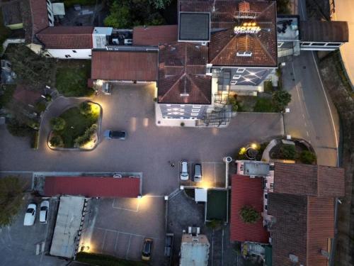 an aerial view of a parking lot at night at Momi's Hotel in Cavarzere