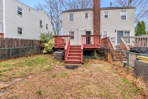 a house with a deck in front of a house at Nest Away near EWR 2 Queen Beds in Edison