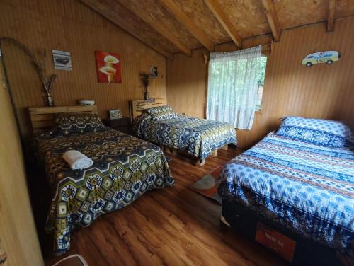Postel nebo postele na pokoji v ubytování Petrohue hospedaje Dónde la Nena