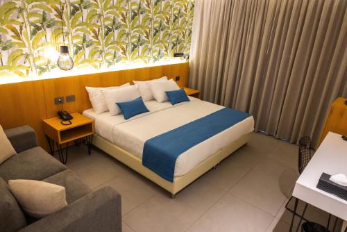Una cama o camas en una habitación de Le Grove Hotel - Superior Boutique