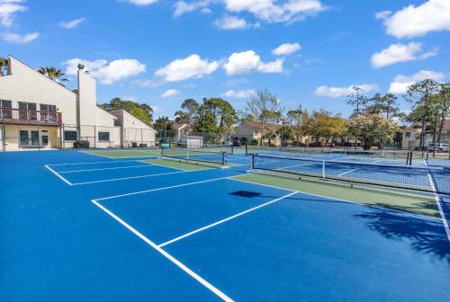 a tennis court with two tennis courts at The Links in Myrtle Beach