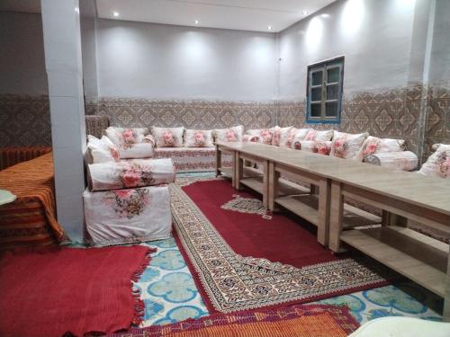 a living room with a couch and a table at almou auberge imilchil in Imilchil
