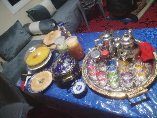 a blue table topped with a tray of differentiatesiatesiatesiatesiatesiatesktop at almou auberge imilchil in Imilchil