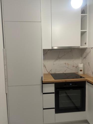 Kuchyň nebo kuchyňský kout v ubytování Apartman ADA