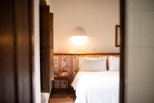 Ένα ή περισσότερα κρεβάτια σε δωμάτιο στο Hotel Plazuela de San Agustín - PSA Hotel