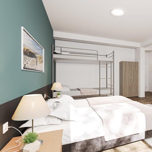 a bedroom with a large white bed and blue walls at WzW Apartments - Wohnraum zum Wohlfühlen in Neubrandenburg