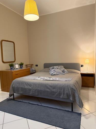 a bedroom with a bed and a large mirror at Villa Annunziata Superior in Aragona