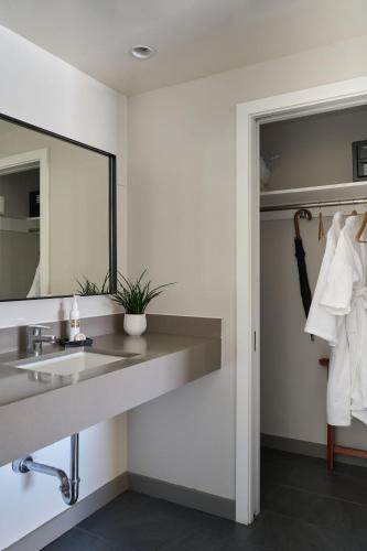 a bathroom with a sink and a mirror at Heathman Hotel in Portland