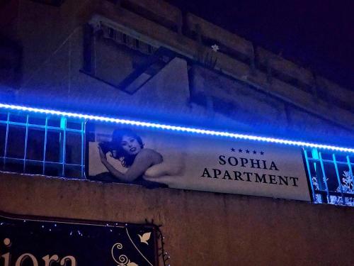 a sign hanging on the side of a building at Sophia Apartment Triora in Triora
