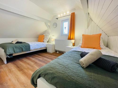 Katil atau katil-katil dalam bilik di Ferienhaus Müdenzauber