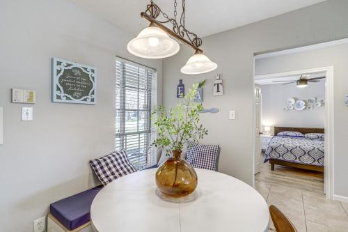 a dining room with a vase on a table at Swim and Unwind Pet-Friendly Home in Spring! in Spring