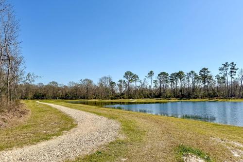 a dirt road next to a lake at Swim and Unwind Pet-Friendly Home in Spring! in Spring