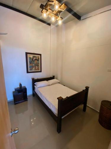 a bedroom with a bed and a ceiling fan at Apto con vista a Santa Rosa in Santa Rosa de Cabal