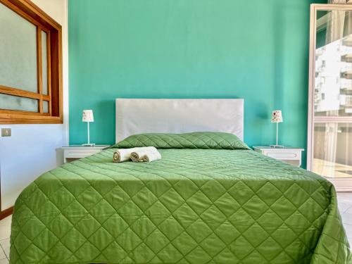Ένα ή περισσότερα κρεβάτια σε δωμάτιο στο b&b holiday