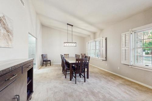 a kitchen and dining room with a table and chairs at Sunset Haven in Peoria