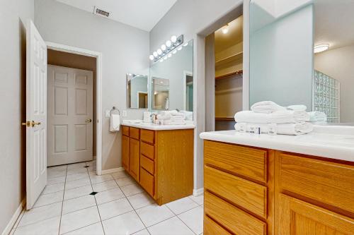 a bathroom with a sink and a mirror at Sunset Haven in Peoria