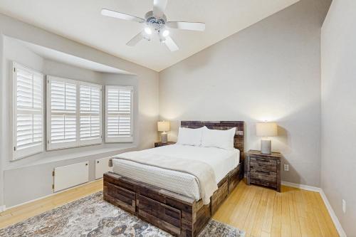 a bedroom with a bed and a ceiling fan at Sunset Haven in Peoria
