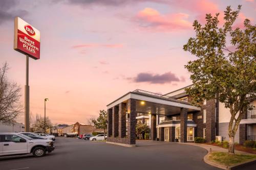 a building with a no parking sign in a parking lot at Best Western Plus Grand Manor Inn in Springfield
