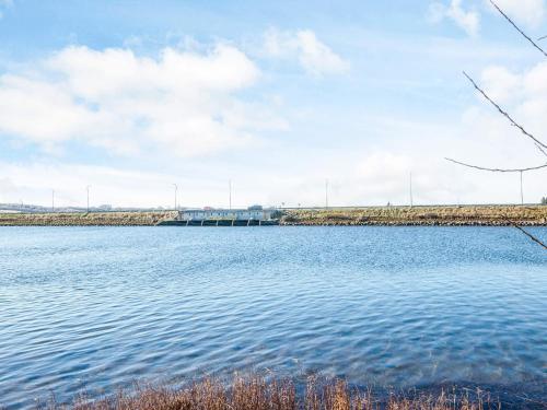 a large body of water with a bridge in the background at 5 star holiday home in Højslev in Højslev