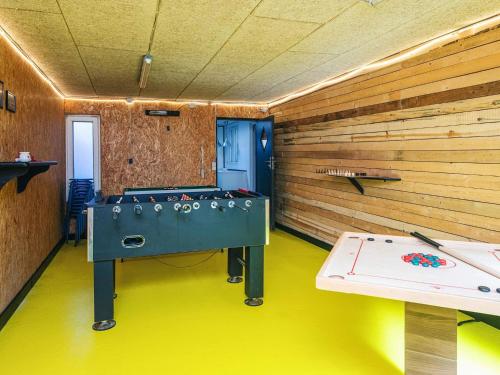 a ping pong table in a room with a wall at Seaside Retreat in Thyboron-By Traum in Thyborøn