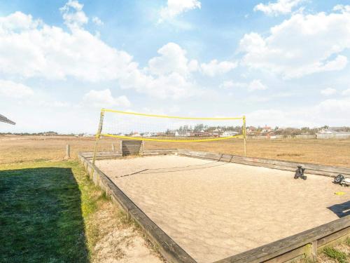 a volley ball net in the middle of a field at Luxury Retreat in Vorupor - By Traum Ferienwohnungen in Snedsted